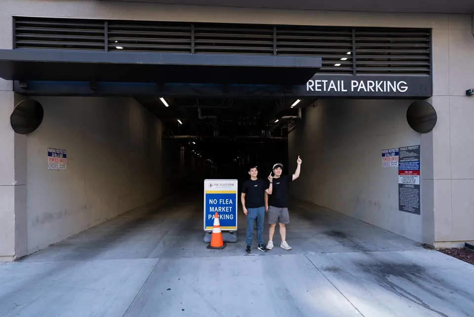 The retail parking garage entrance on Flea Market Pl